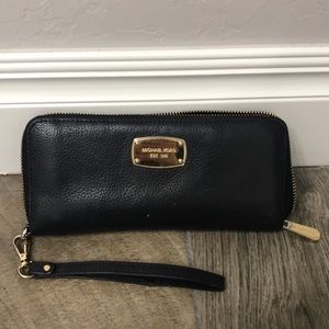 Michael Kors black and gold wallet/ wristlet.